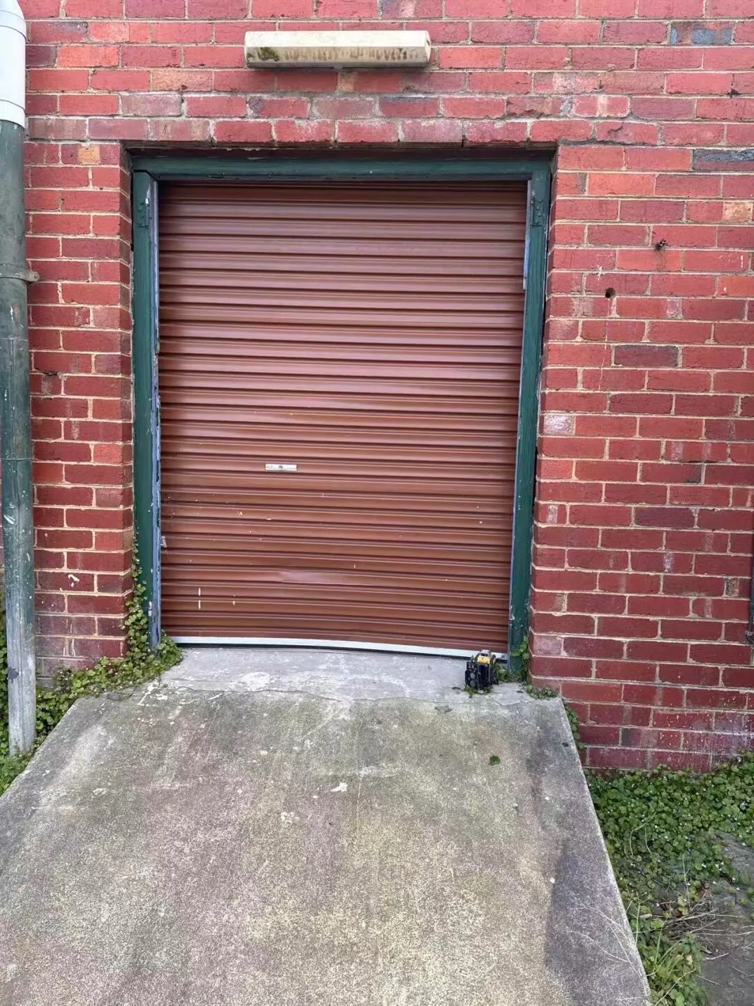 Original commercial roller door before replacement