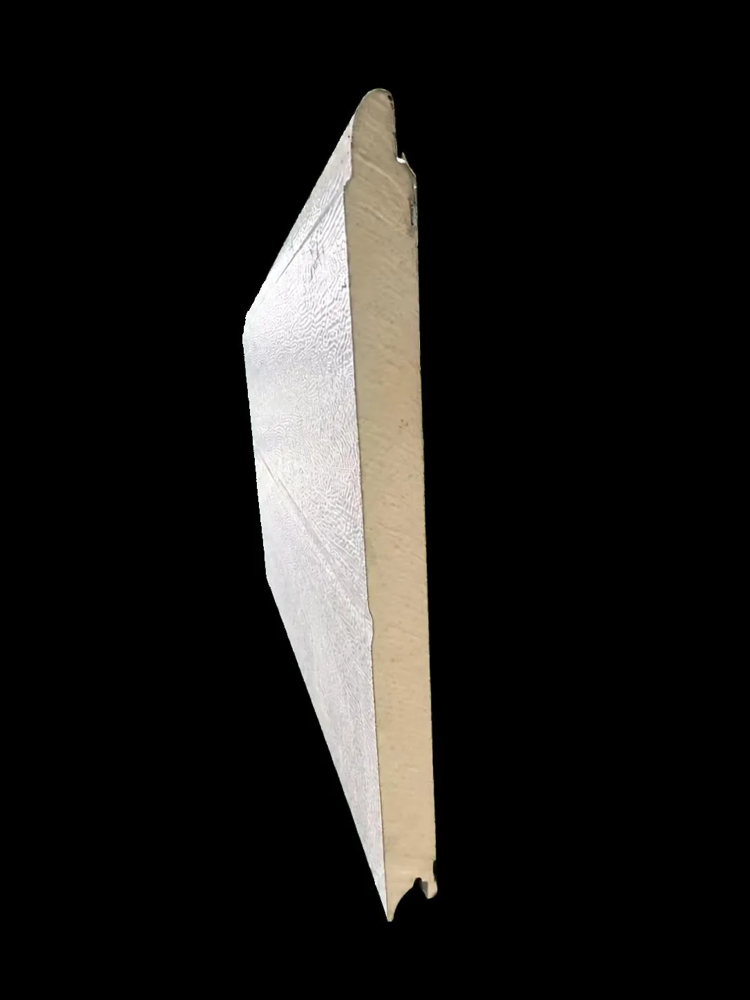 Supplier cutaway of an insulated sectional panel, showing its inner core and shaped panel edges